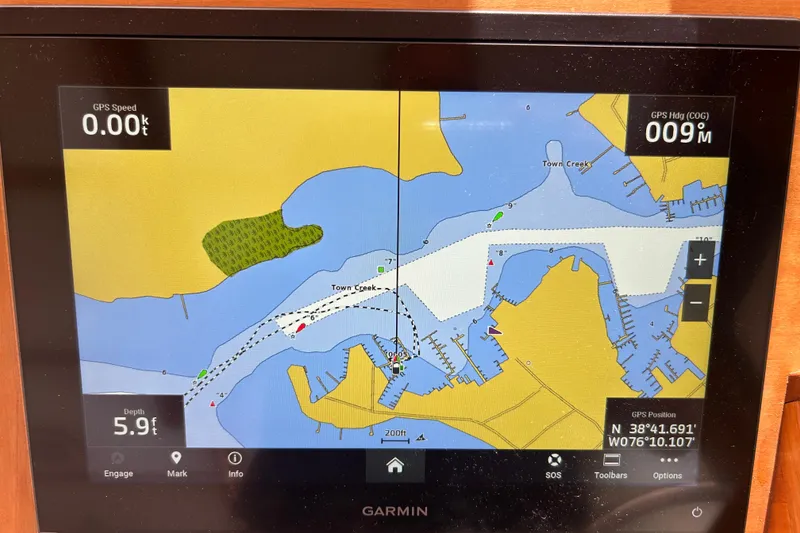 Slide: The Image of Garmin GPS display on 2004 Sabre 36 FB, showing nautical map and navigation data. - 14