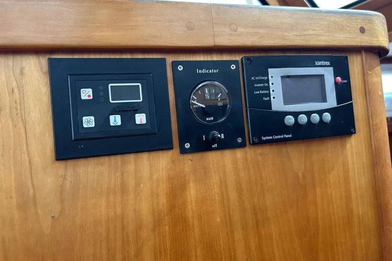 Slide: The Image of Control panels on a 2004 Sabre 36 FB boat dashboard. - 19