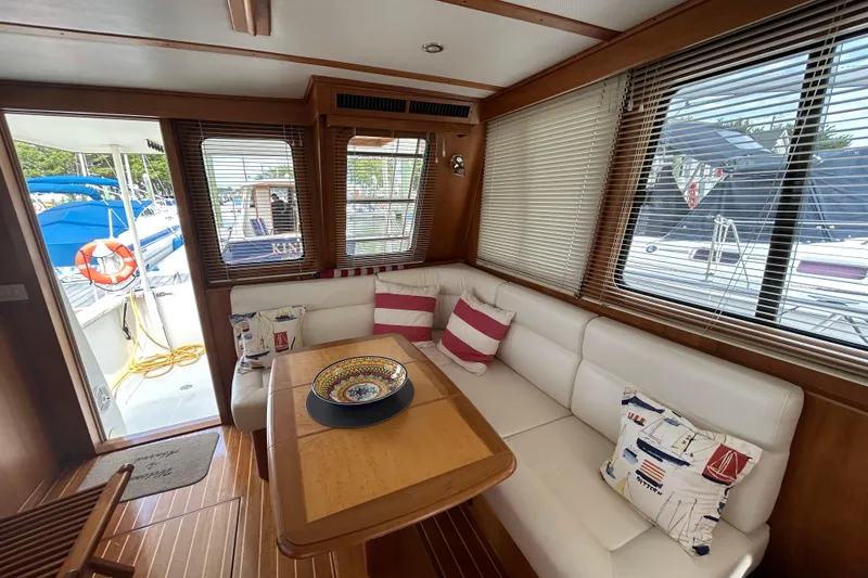 Slide: The Image of Luxurious interior of 2004 Sabre 36 FB yacht with cozy seating and nautical decor. - 25