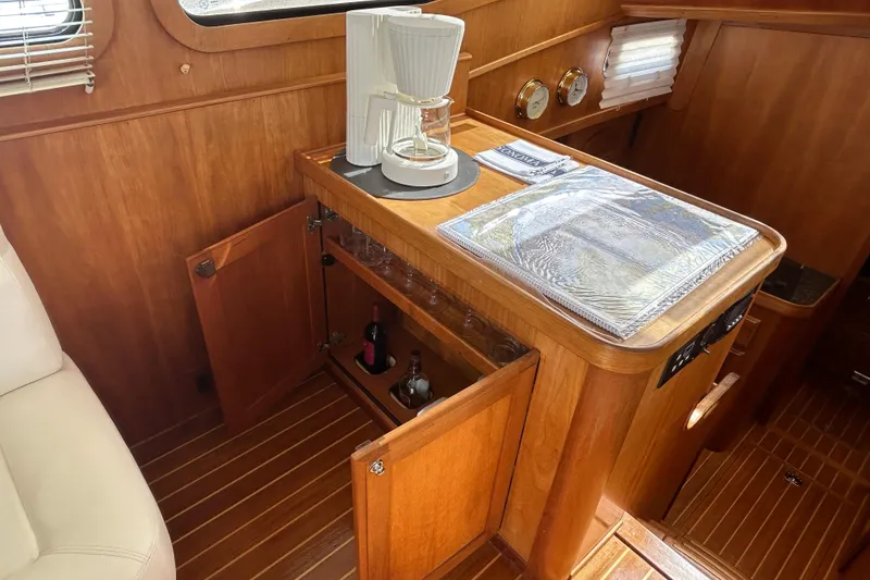 Slide: The Image of Interior of 2004 Sabre 36 FB yacht with wooden cabinetry and coffee maker. - 27