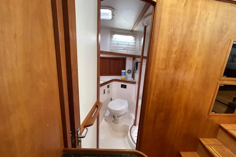 Slide: The Image of Interior view of 2004 Sabre 36 FB yacht bathroom with wooden finish. - 37