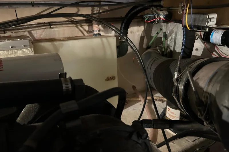 Slide: The Image of Engine room of a 2004 Sabre 36 FB boat with visible wiring and components. - 42