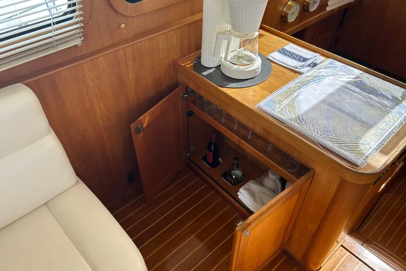Slide: The Image of Interior of 2004 Sabre 36 FB yacht with wooden cabinetry and coffee maker. - 28