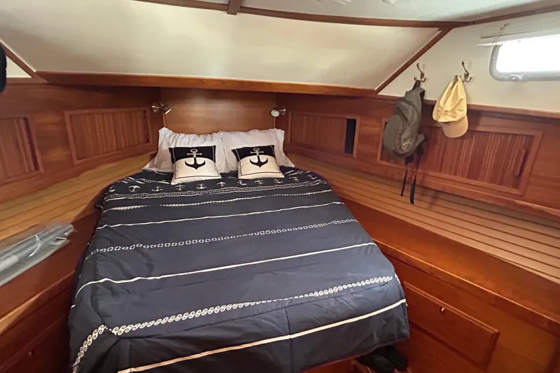 Slide: The Image of Cozy cabin interior of 2004 Sabre 36 FB yacht with nautical-themed bedding. - 34