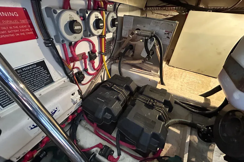 Slide: The Image of Engine room of 2004 Sabre 36 FB boat with wiring and battery setup. - 40