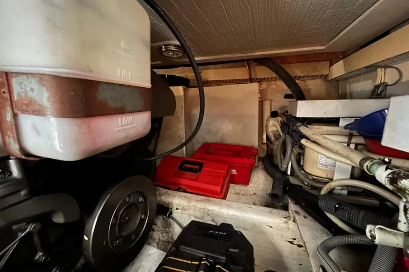 Slide: The Image of Engine room of a 2004 Sabre 36 FB boat with various mechanical components. - 43