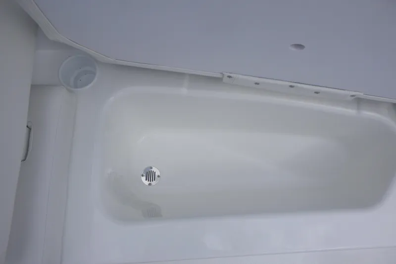 Slide: The Image of Interior view of 2026 Tahoe T16 boat's white storage compartment. - 11