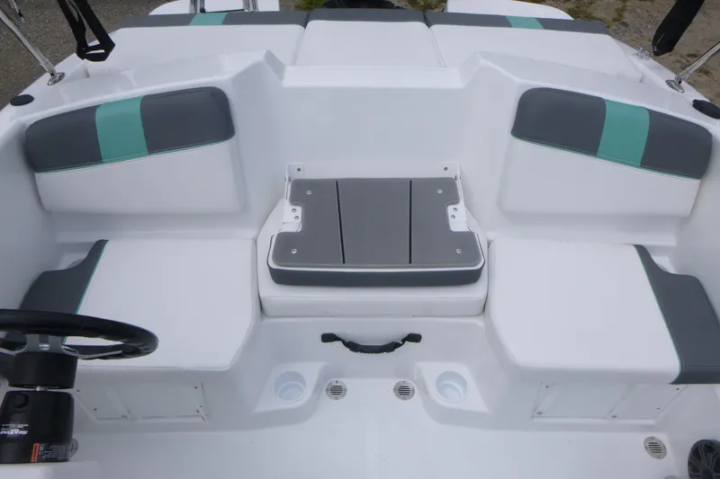 Slide: The Image of 2026 Tahoe T16 boat interior with white and teal seating arrangement. - 7