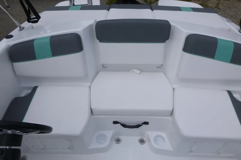 Slide: The Image of 2026 Tahoe T16 boat interior with white and gray seating, teal accents. - 8