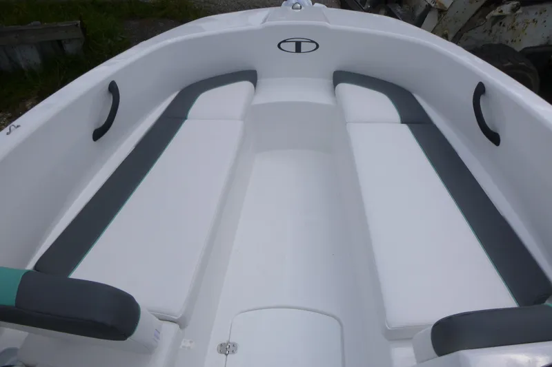 Slide: The Image of 2026 Tahoe T16 boat interior with white and gray seating. - 9
