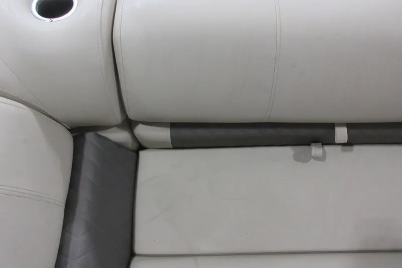 Slide: The Image of 2024 Sun Tracker Party Barge 24 DLX interior seating with cup holder. - 10