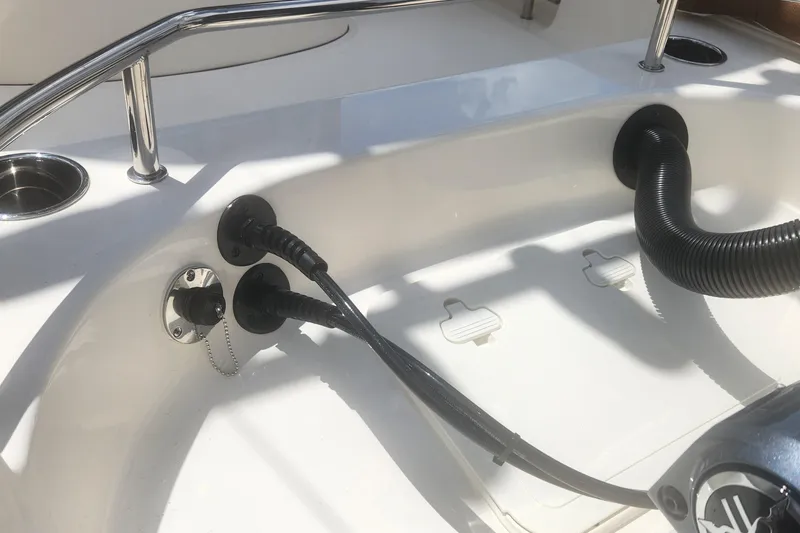 Slide: The Image of 2026 Pioneer 202 Sportfish boat deck with cables and stainless steel railing. - 4