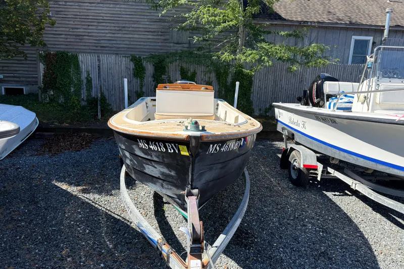 Slide: The Image of 2003 Roth Bilt 16 Skiff boat on trailer, parked outdoors. - 2