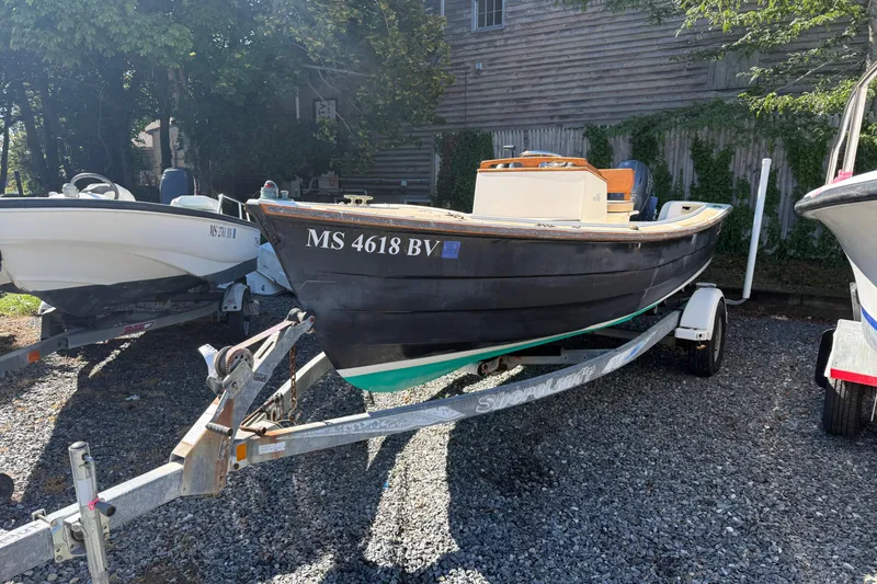 Slide: The Image of 2003 Roth Bilt 16 Skiff boat on trailer, parked outdoors. - 5