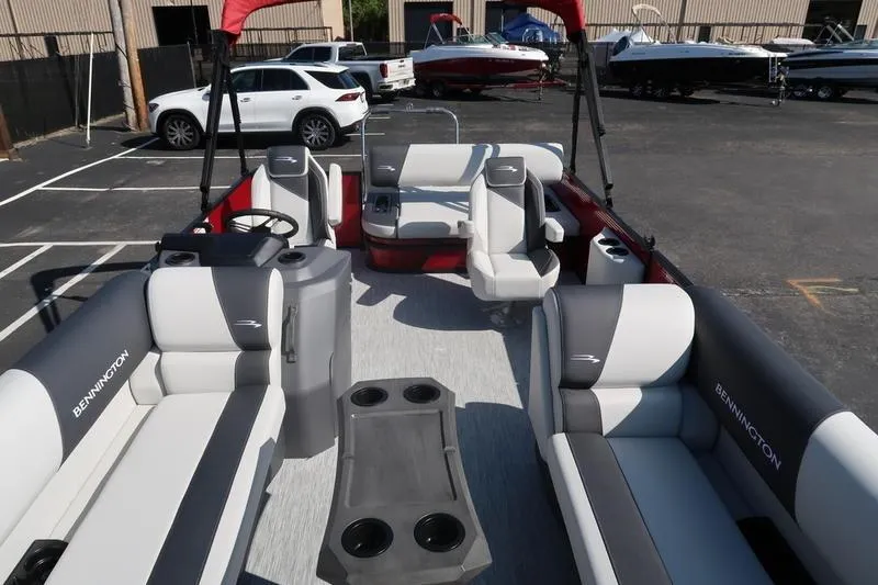 Slide: The Image of 2026 Bennington S Swingback 22 SSB SPS pontoon boat interior with seating and cup holders. - 10