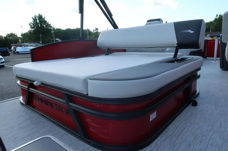 Slide: The Image of 2026 Bennington S Swingback 22 SSB SPS pontoon boat with red and gray seating. - 5