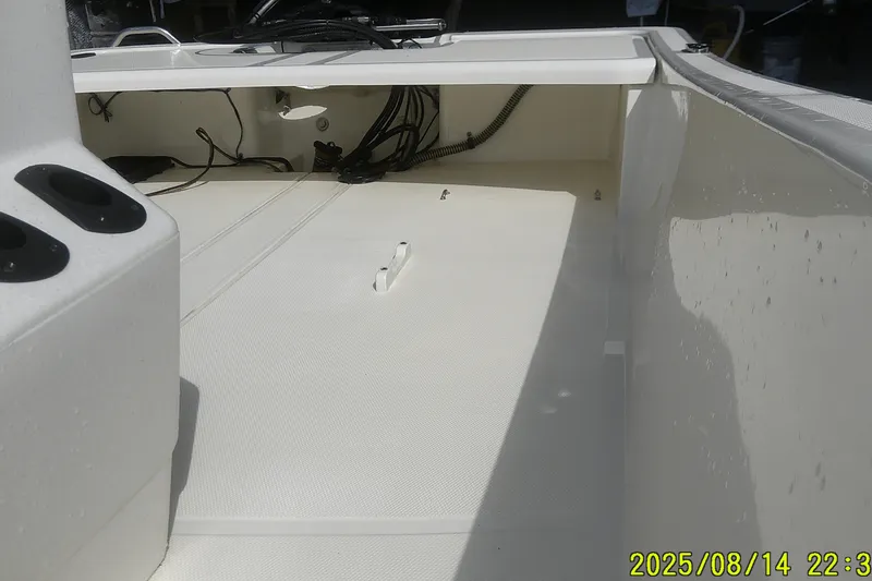 Slide: The Image of 2024 Mako Pro Skiff 15 CC interior view, showcasing deck and console details. - 14