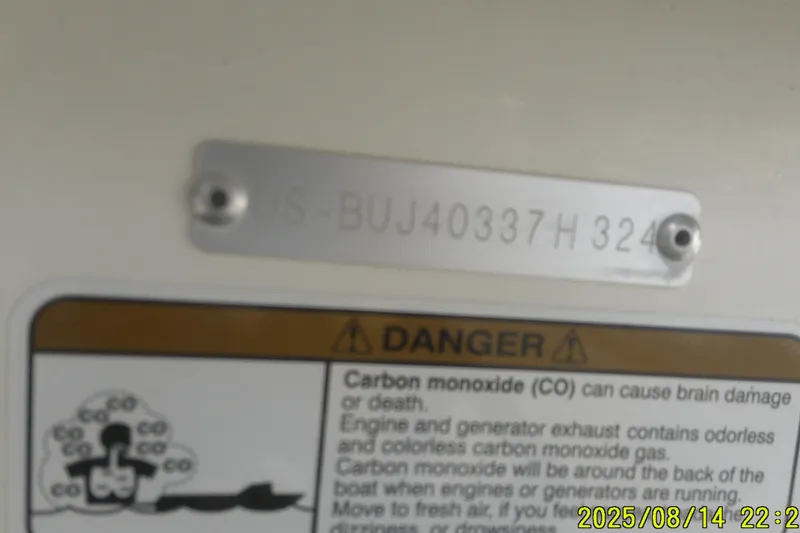 Slide: The Image of 2024 Mako Pro Skiff 15 CC hull identification plate with carbon monoxide warning label. - 20