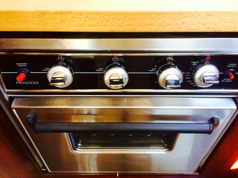 Slide: The Image of Stainless steel oven with control knobs, labeled "Princess," in a 1971 Formosa 41. - 11