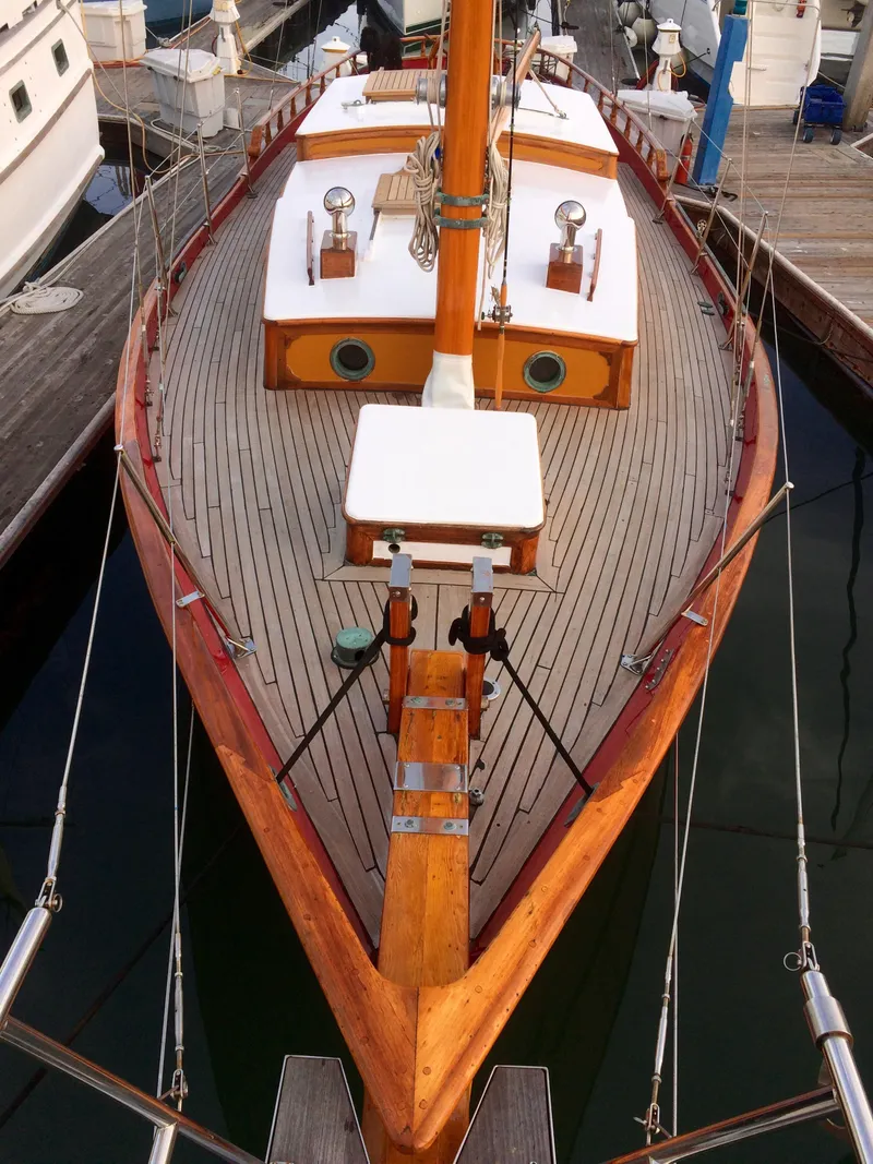 Slide: The Image of 1971 Formosa 41 sailboat with wooden deck, docked at marina. - 2