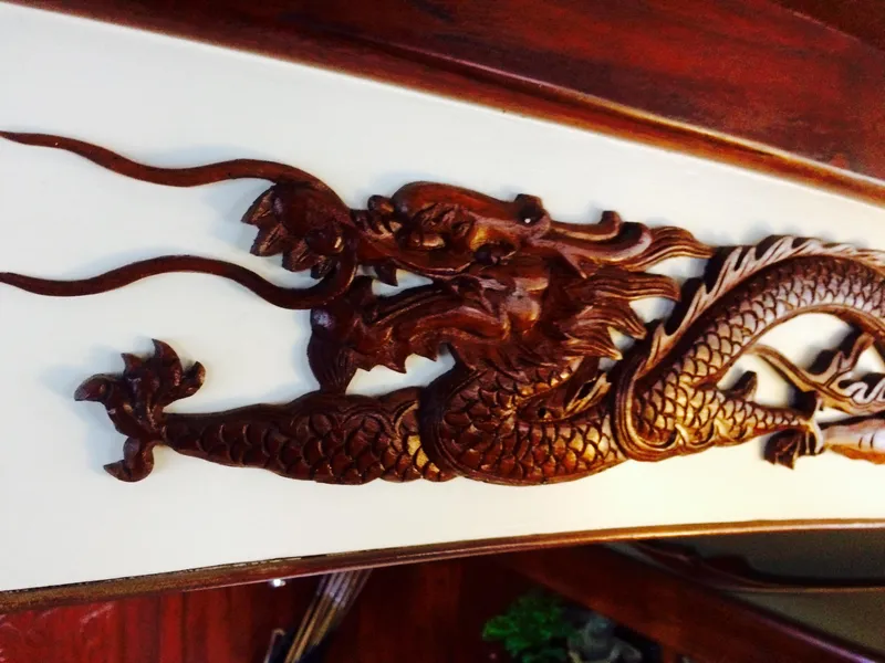 Slide: The Image of Intricate dragon carving on 1971 Formosa 41 yacht interior. - 22
