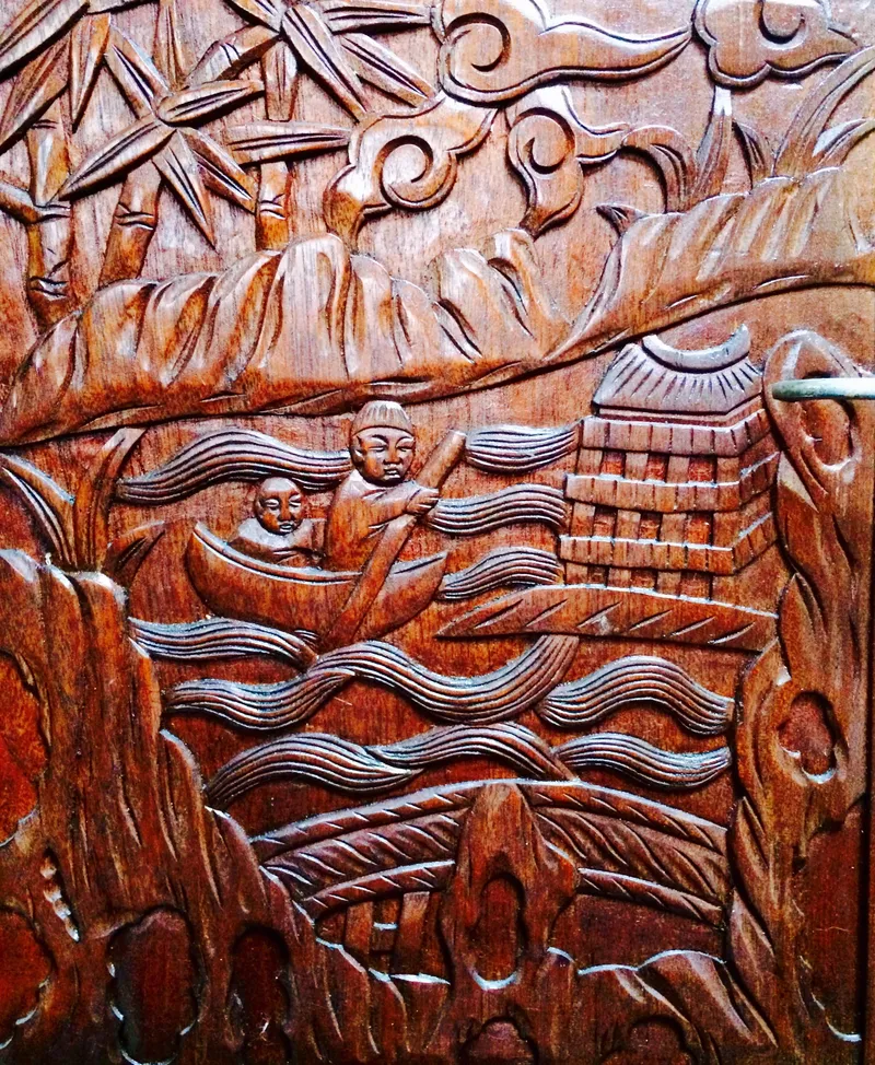 Slide: The Image of Intricate wooden carving depicting a boat scene with figures and a pagoda, Formosa 41, 1971. - 24