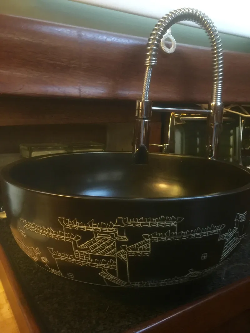 Slide: The Image of Vintage Formosa 41 sink with intricate design, featuring a modern faucet, 1971 model. - 27