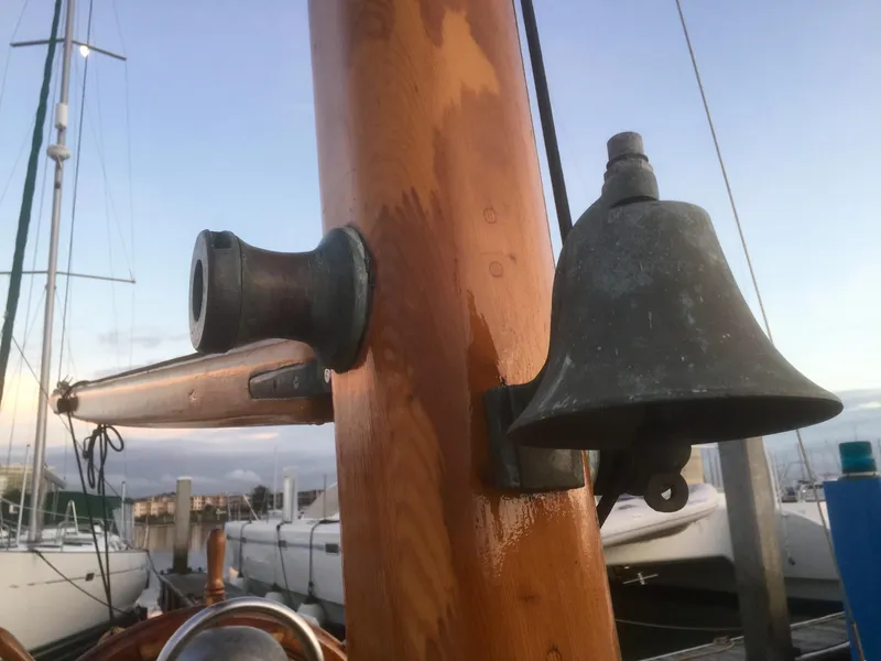 Slide: The Image of Vintage Formosa 41 sailboat mast with bell, docked at marina, 1971 model. - 30