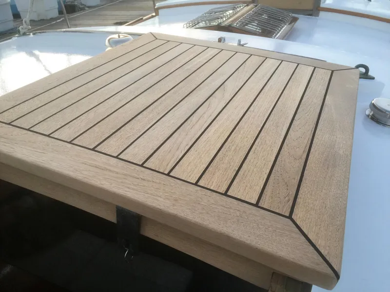 Slide: The Image of Wooden deck hatch on 1971 Formosa 41 sailboat, showcasing sleek craftsmanship and design. - 31