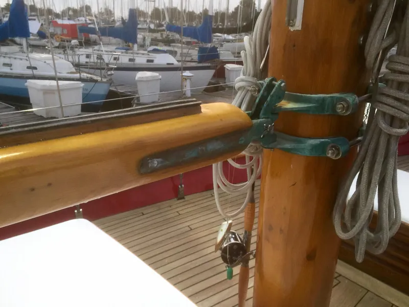Slide: The Image of Wooden mast and rigging on a 1971 Formosa 41 sailboat, docked in a marina. - 39