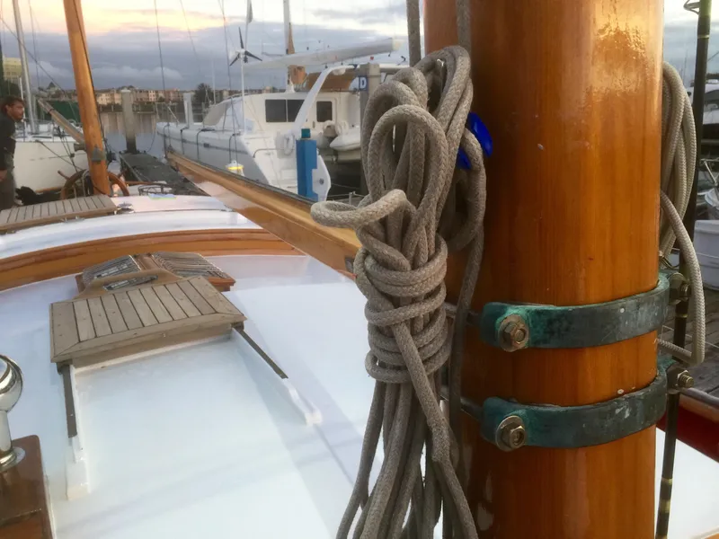 Slide: The Image of 1971 Formosa 41 sailboat deck with coiled rope and wooden mast. - 40