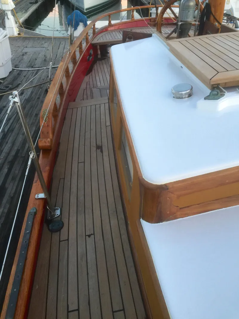 Slide: The Image of 1971 Formosa 41 sailboat deck with wooden details and white cabin top. - 50