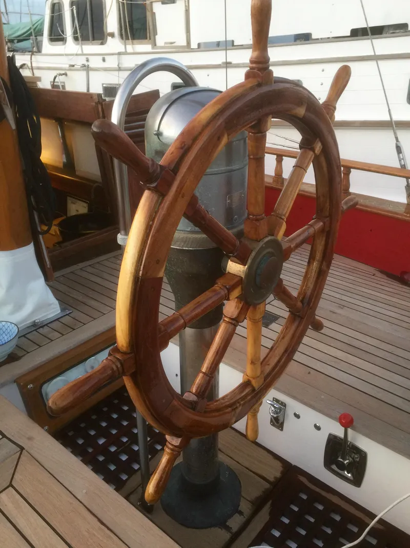 Slide: The Image of Wooden steering wheel on a 1971 Formosa 41 sailboat deck. - 52