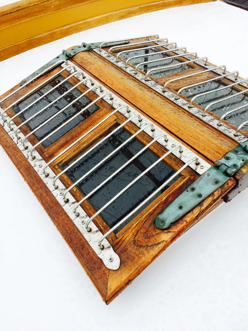 Slide: The Image of Wooden hatch with metal bars on a 1971 Formosa 41 sailboat. - 7