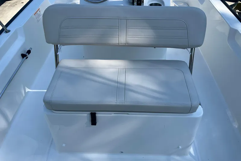 Slide: The Image of 2026 Boston Whaler 170 Montauk boat seat, featuring sleek white upholstery and modern design. - 14
