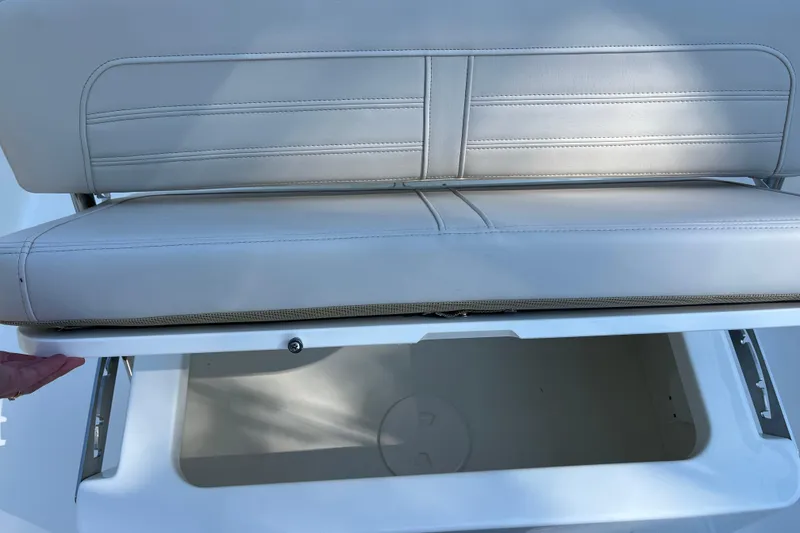 Slide: The Image of 2026 Boston Whaler 170 Montauk seat with storage compartment open. - 17