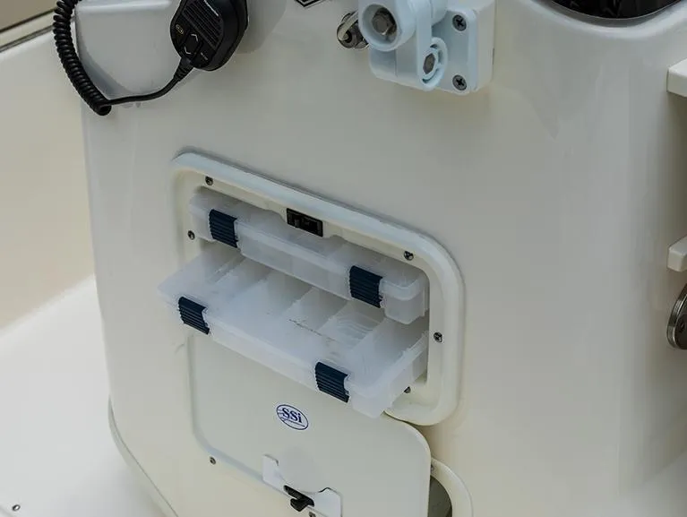 Slide: The Image of 2026 Boston Whaler 170 Montauk interior with Igloo cooler and cushioned seating. - 7