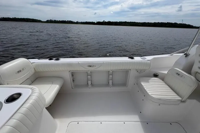 Slide: The Image of 2007 Seahunt VICTORY 225 boat interior with white seating, on calm water. - 16
