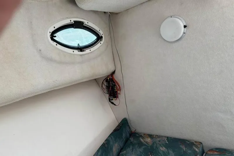 Slide: The Image of Interior cabin of 2007 Seahunt VICTORY 225 boat with porthole and seating. - 19