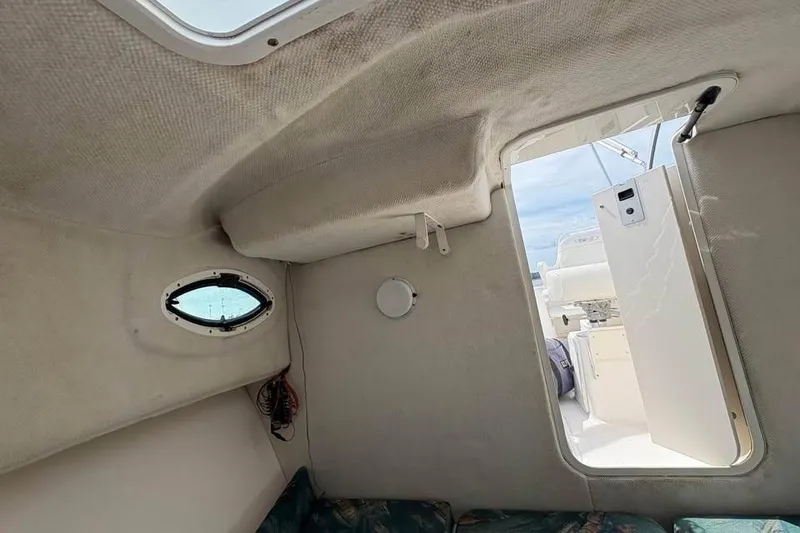 Slide: The Image of Interior cabin view of 2007 Seahunt VICTORY 225 boat with open hatch. - 20