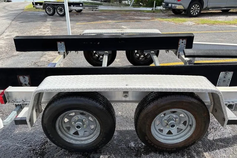 Slide: The Image of Trailer for 2007 Seahunt VICTORY 225 boat, featuring dual wheels and sturdy construction. - 7