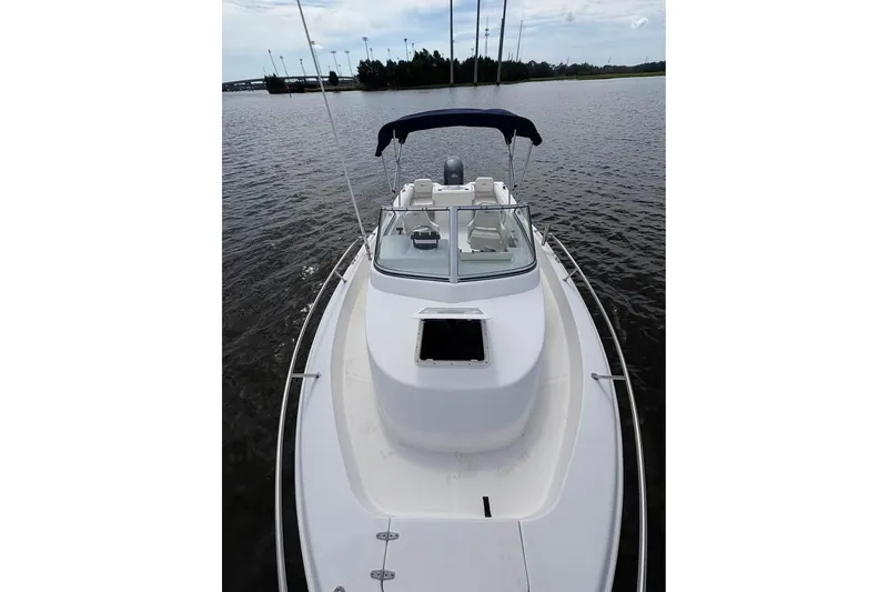 Slide: The Image of 2007 Seahunt VICTORY 225 boat on calm water, featuring a sleek design and canopy. - 8