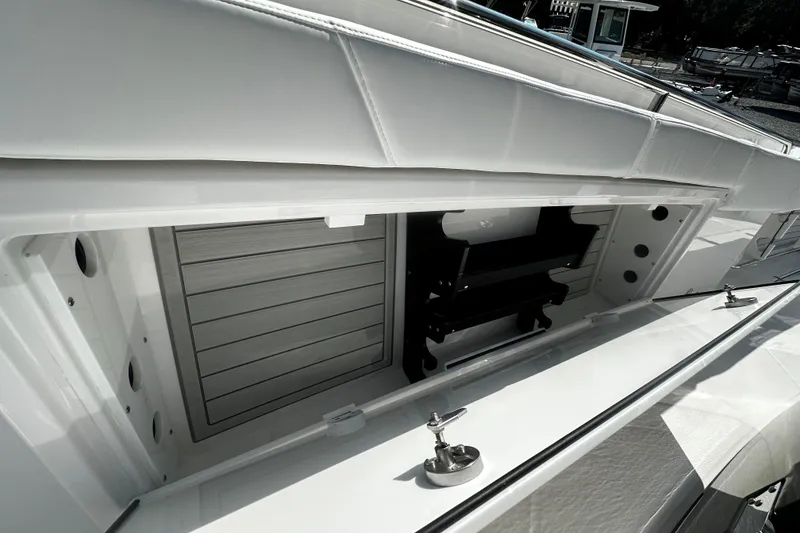 Slide: The Image of 2025 Blackfin 332 CC boat storage compartment with sleek design and modern features. - 10