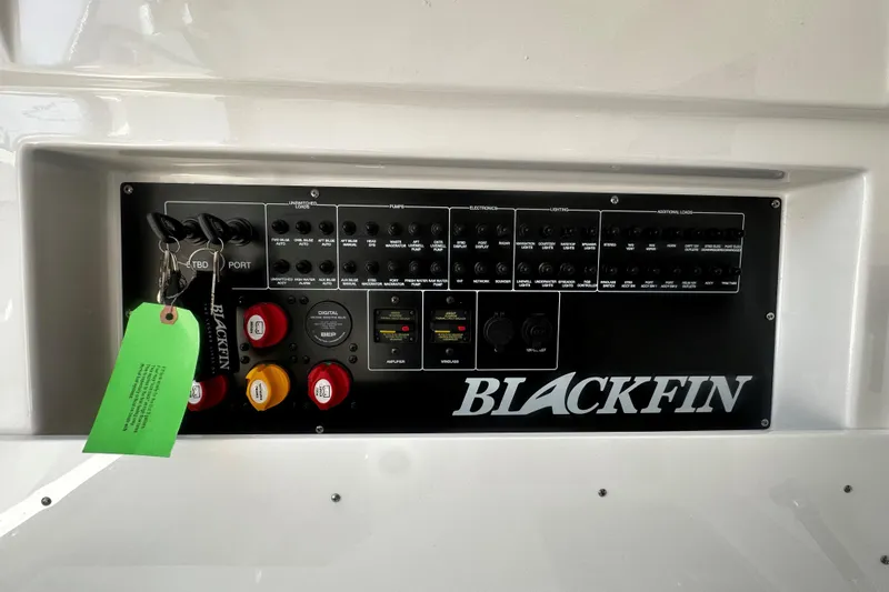 Slide: The Image of Control panel of 2025 Blackfin 332 CC boat with labeled switches and keys. - 12