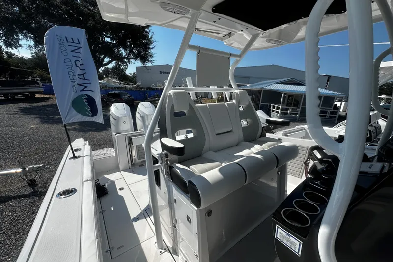 Slide: The Image of 2025 Blackfin 332 CC boat interior with seating and controls at Emerald Coast Marine. - 16