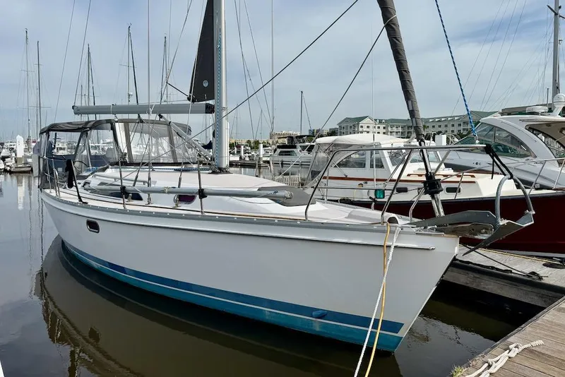 Slide: The Image of Sailboat Catalina 355, 2011 model, docked at marina with clear skies. - 0
