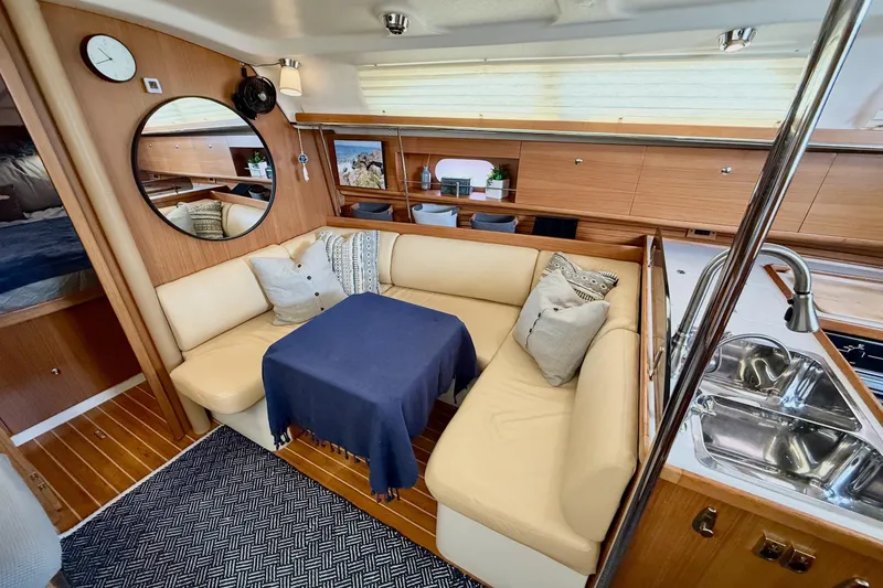 Slide: The Image of Interior of 2011 Catalina 355 yacht with cozy seating and modern kitchen area. - 24