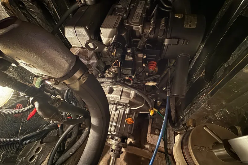 Slide: The Image of Engine compartment of a 2011 Catalina 355 sailboat, showcasing detailed mechanical components. - 39