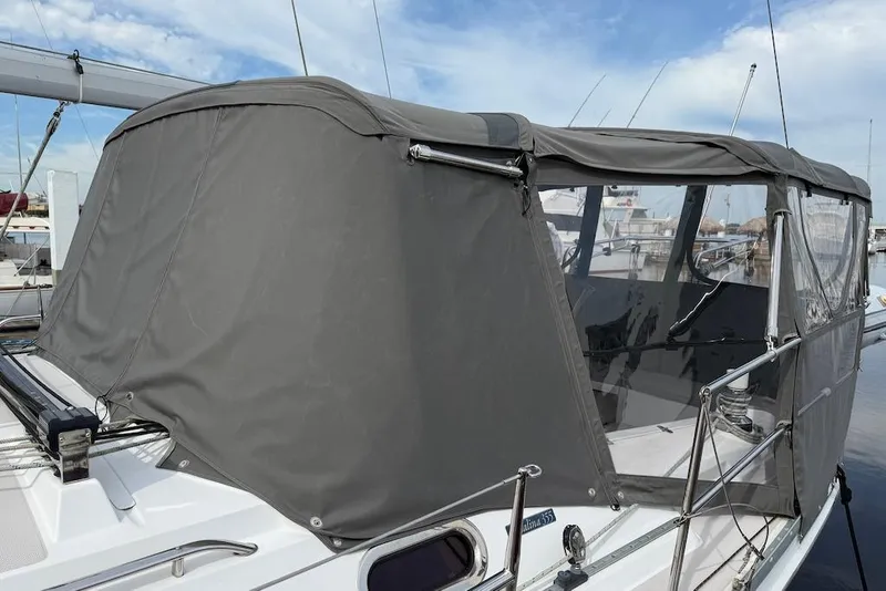 Slide: The Image of 2011 Catalina 355 sailboat with gray canvas cover at marina. - 4