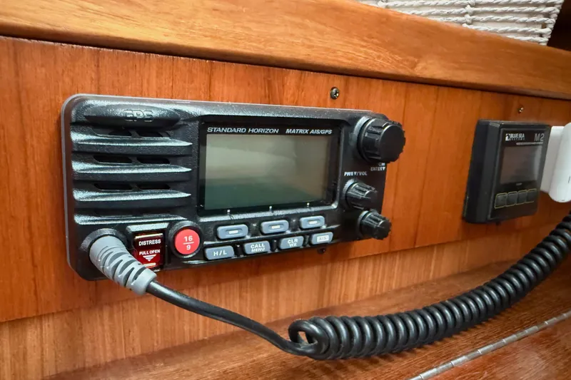 Slide: The Image of Standard Horizon radio on 2011 Catalina 355 sailboat, featuring distress button and GPS functionality. - 41